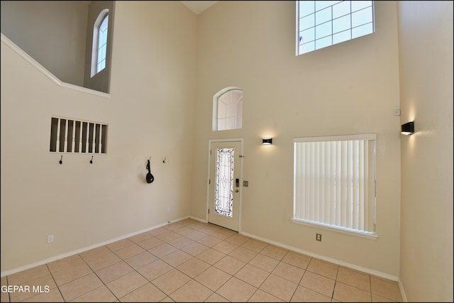 12712 Tierra Aurora Dr, El Paso, TX 79938 - foyer featuring a high ceiling, plenty of natural light, and light tile patterned floors