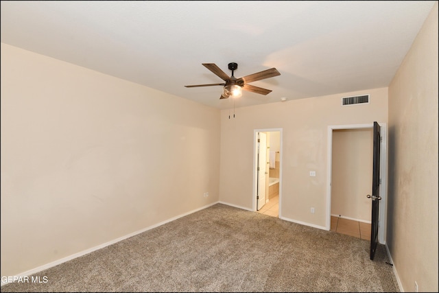 12712 Tierra Aurora Dr, El Paso, TX 79938 - unfurnished bedroom with light carpet, connected bathroom, and a ceiling fan