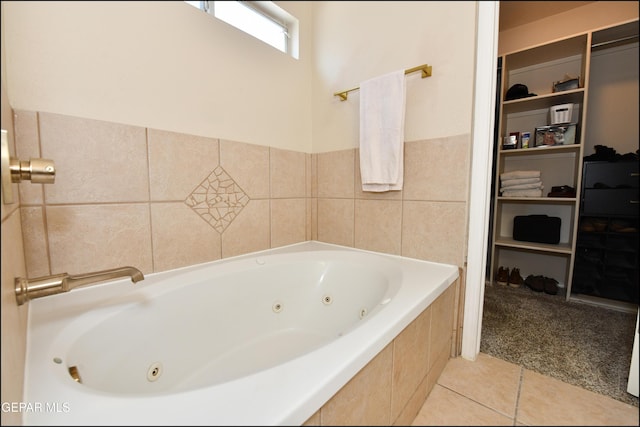 12712 Tierra Aurora Dr, El Paso, TX 79938 - bathroom with a whirlpool tub, tile patterned floors, and a spacious closet