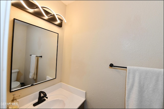 12712 Tierra Aurora Dr, El Paso, TX 79938 - half bathroom featuring toilet and vanity