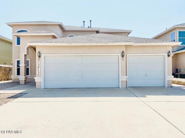 12712 Tierra Aurora Dr, El Paso, TX 79938 - view of front of property with concrete driveway, a garage, and stucco siding
