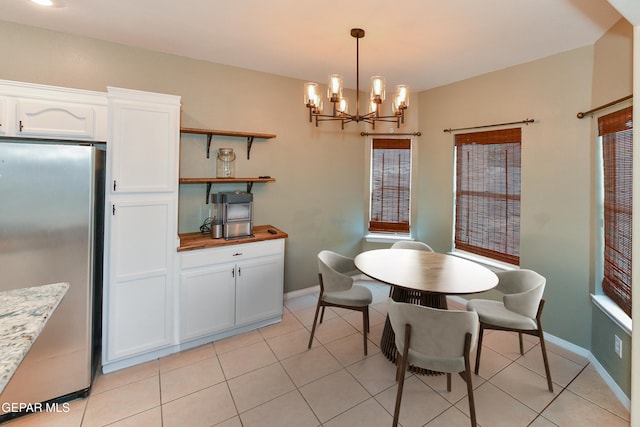 12712 Tierra Aurora Dr, El Paso, TX 79938 - dining space featuring a chandelier and light tile patterned floors