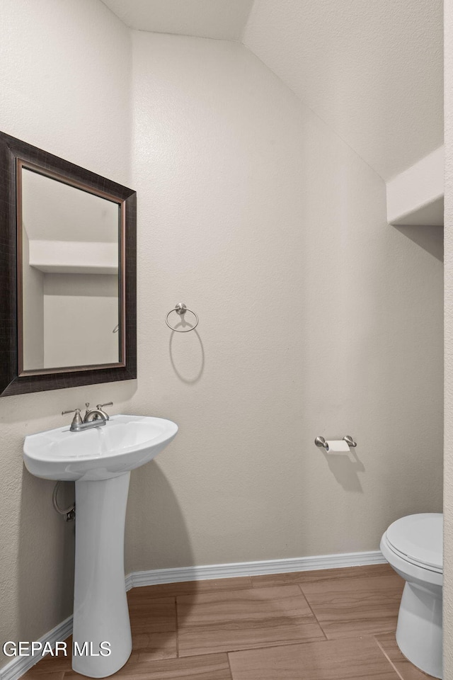 11470 Dawn View Rd Unit B, Socorro, TX 79927 - half bath with vaulted ceiling and wood finished floors