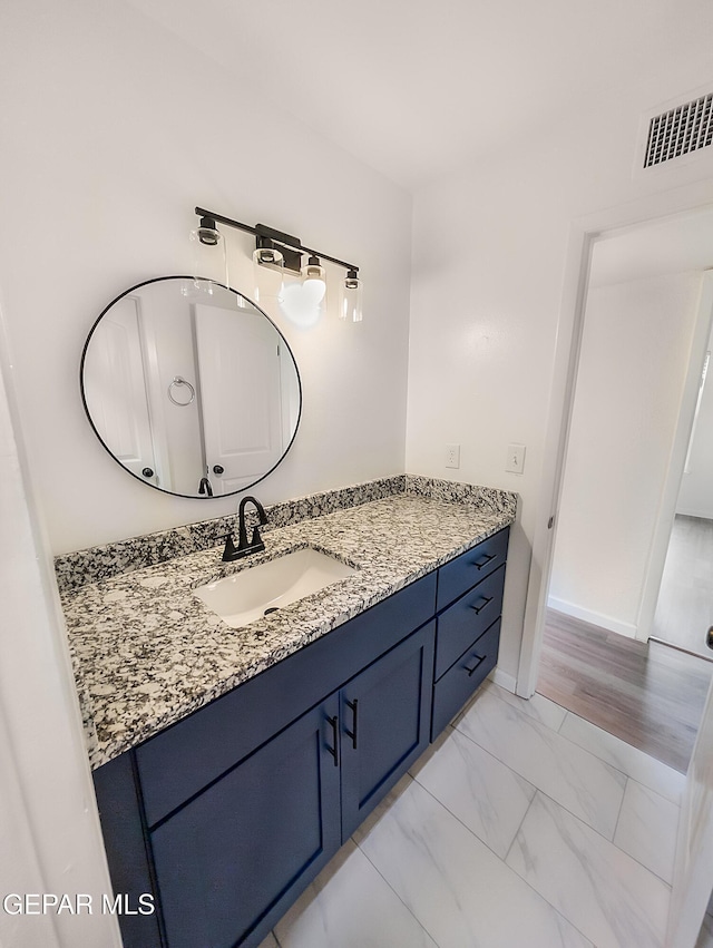 3425 Dialrock Ln, El Paso, TX 79935 - bathroom with vanity and marble finish flooring