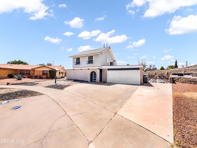 3425 Dialrock Ln, El Paso, TX 79935 - traditional-style home with an attached garage, brick siding, and driveway
