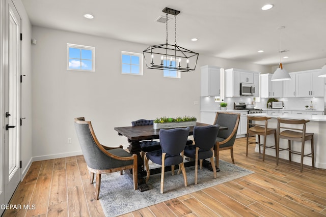 905 Bilton Pl, El Paso, TX 79928 - dining area with light wood-style flooring, a chandelier, and recessed lighting
