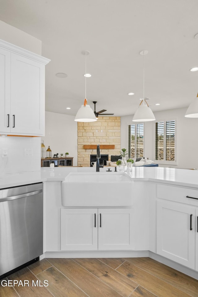 905 Bilton Pl, El Paso, TX 79928 - kitchen with dishwasher, wood finished floors, hanging light fixtures, a fireplace, and recessed lighting