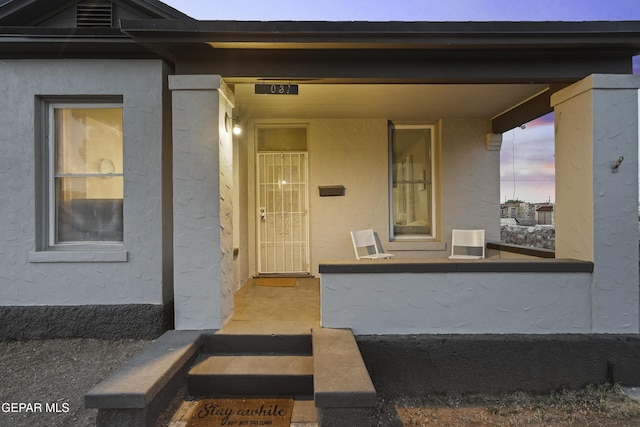 3031 Memphis Ave, El Paso, TX 79930 - property entrance with stucco siding and a porch