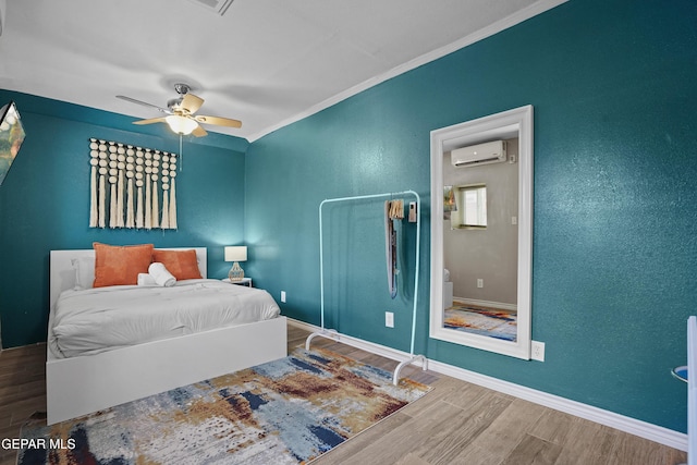 3031 Memphis Ave, El Paso, TX 79930 - bedroom with a wall unit AC, wood finished floors, ornamental molding, and a ceiling fan