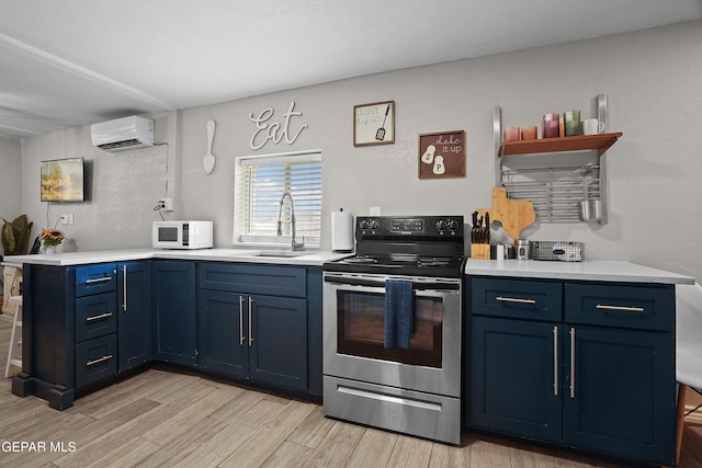 3031 Memphis Ave, El Paso, TX 79930 - kitchen featuring electric stove, blue cabinets, an AC wall unit, and white microwave