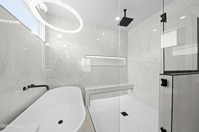 3932 Surmise St, El Paso, TX 79938 - full bathroom with a freestanding bath, a marble finish shower, and tile walls