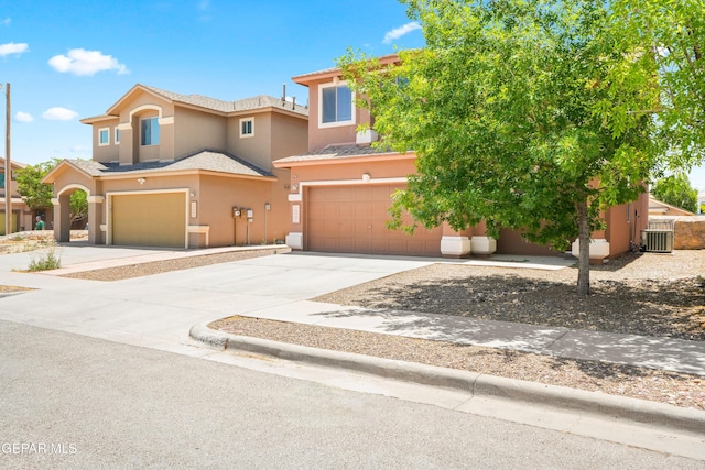 5036 Silver Ranch Ave, El Paso, TX 79934 - view of front facade with a garage, stucco siding, and concrete driveway