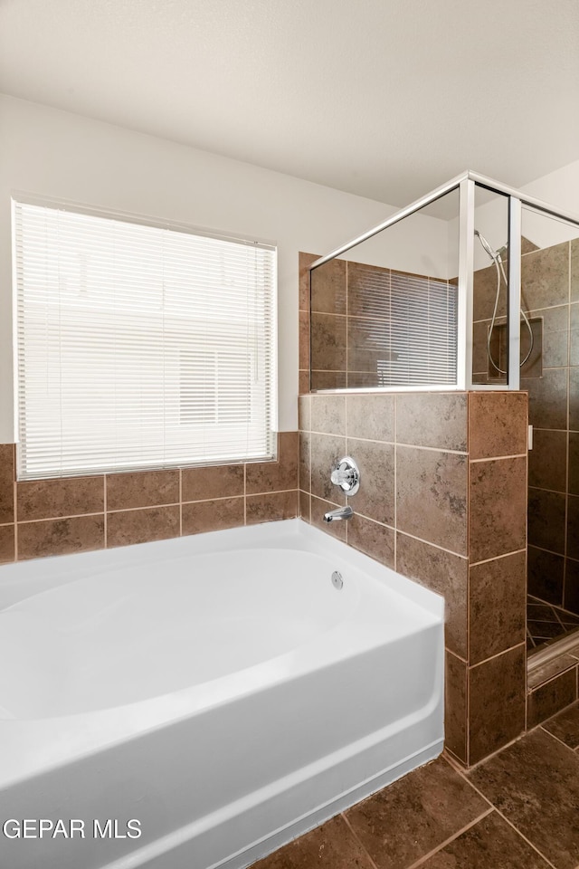 5036 Silver Ranch Ave, El Paso, TX 79934 - full bath featuring a bath, a stall shower, and tile patterned flooring