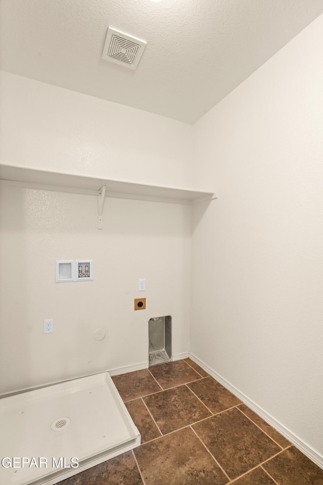 5036 Silver Ranch Ave, El Paso, TX 79934 - laundry room featuring hookup for a washing machine, hookup for an electric dryer, gas dryer hookup, and dark tile patterned flooring