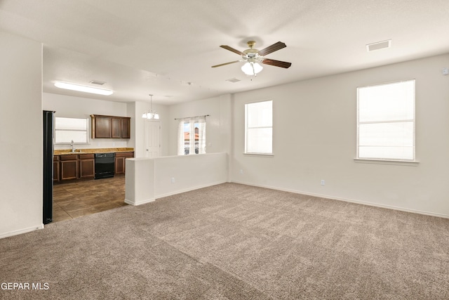 5036 Silver Ranch Ave, El Paso, TX 79934 - unfurnished living room featuring carpet flooring, ceiling fan, and a chandelier