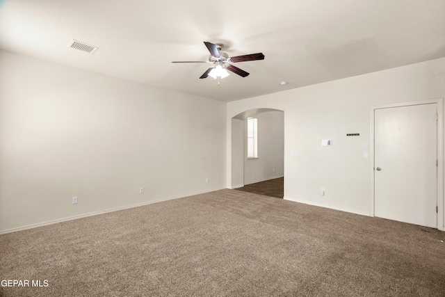 5036 Silver Ranch Ave, El Paso, TX 79934 - empty room featuring arched walkways, ceiling fan, and carpet