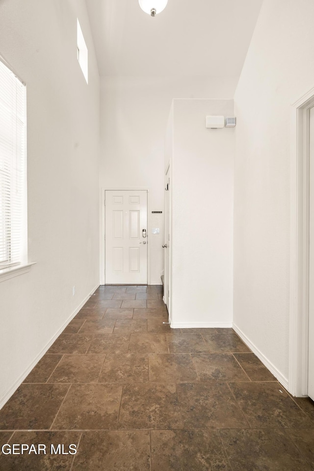 5036 Silver Ranch Ave, El Paso, TX 79934 - hallway with stone finish flooring and a high ceiling