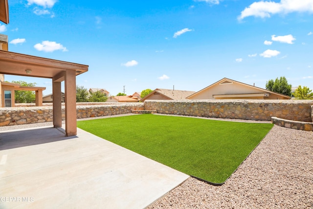 5036 Silver Ranch Ave, El Paso, TX 79934 - fenced backyard with a patio