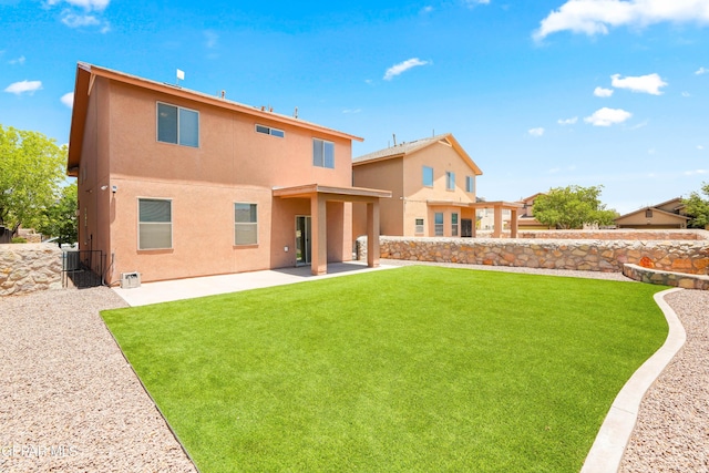 5036 Silver Ranch Ave, El Paso, TX 79934 - rear view of house with stucco siding and a patio