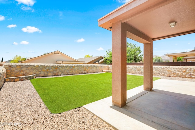 5036 Silver Ranch Ave, El Paso, TX 79934 - fenced backyard with a patio area