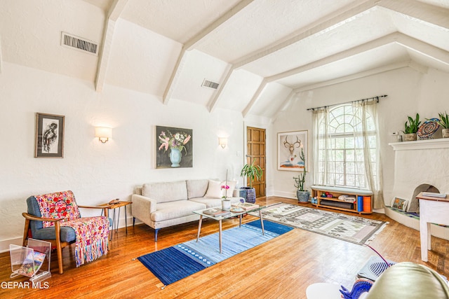 4021 Hastings Dr, El Paso, TX 79903 - living room featuring lofted ceiling, wood finished floors, and a fireplace