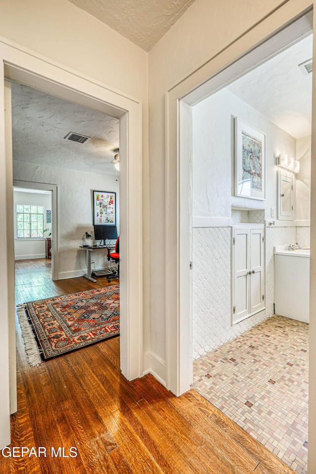 4021 Hastings Dr, El Paso, TX 79903 - hall featuring wood finished floors
