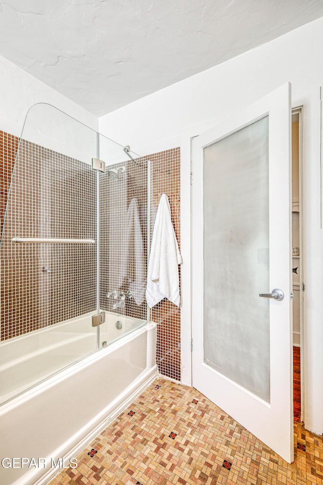 4021 Hastings Dr, El Paso, TX 79903 - bathroom featuring bath / shower combo with glass door