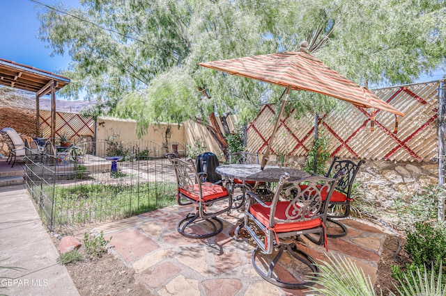 4021 Hastings Dr, El Paso, TX 79903 - fenced backyard with outdoor dining area and a patio area