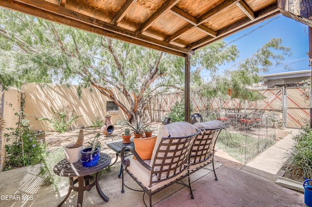 4021 Hastings Dr, El Paso, TX 79903 - fenced backyard with outdoor dining area and a patio