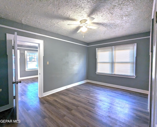 3308 Tularosa Ave, El Paso, TX 79903 - empty room featuring a ceiling fan, dark wood-style floors, and a textured ceiling