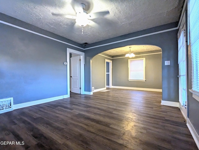 3308 Tularosa Ave, El Paso, TX 79903 - empty room featuring arched walkways, wood finished floors, ceiling fan, and a textured ceiling