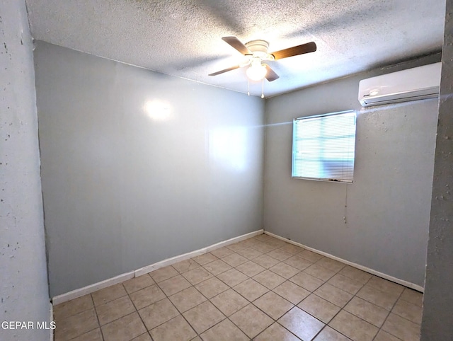 3308 Tularosa Ave, El Paso, TX 79903 - spare room with a wall unit AC, light tile patterned floors, a ceiling fan, and a textured ceiling
