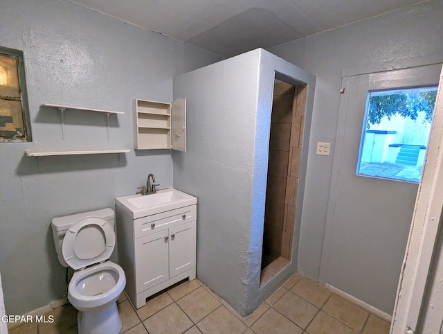 3308 Tularosa Ave, El Paso, TX 79903 - bathroom featuring tile patterned floors, a stall shower, and vanity