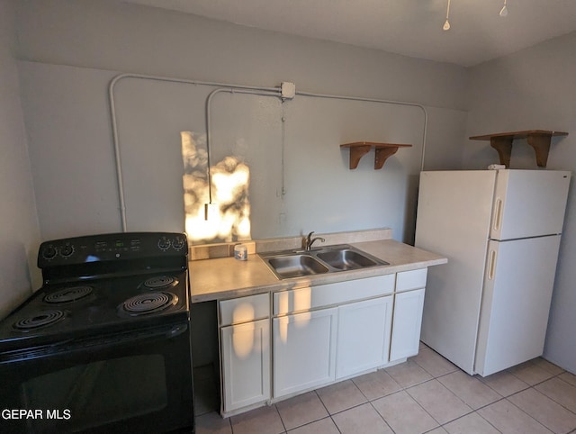3308 Tularosa Ave, El Paso, TX 79903 - kitchen with black range with electric cooktop, freestanding refrigerator, open shelves, and light countertops