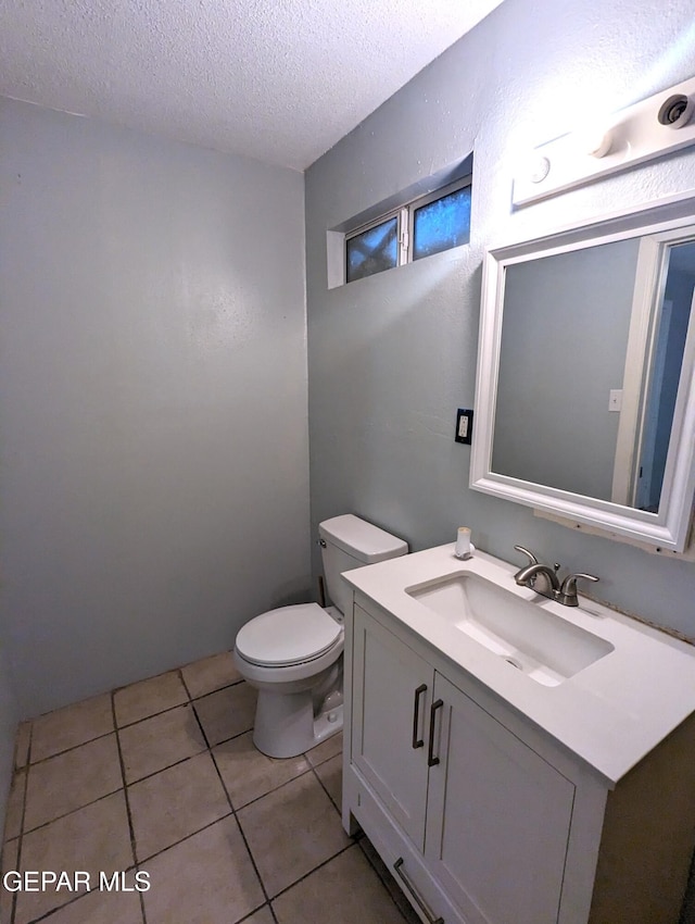 3308 Tularosa Ave, El Paso, TX 79903 - bathroom featuring a textured ceiling, vanity, and tile patterned floors