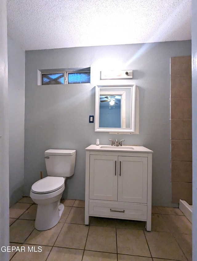 3308 Tularosa Ave, El Paso, TX 79903 - bathroom featuring a textured ceiling, vanity, and tile patterned flooring