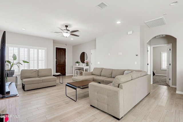 12820 Monmouth Ave, El Paso, TX 79928 - living room featuring arched walkways, a ceiling fan, light wood-style floors, and recessed lighting