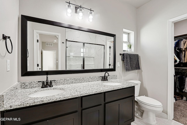 12820 Monmouth Ave, El Paso, TX 79928 - full bath featuring a walk in closet, a shower stall, and double vanity