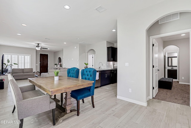 12820 Monmouth Ave, El Paso, TX 79928 - dining space with arched walkways, recessed lighting, ceiling fan, and light wood-style floors