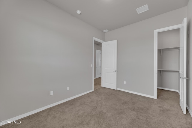 14772 John Mcneely Ave, El Paso, TX 79938 - unfurnished bedroom with carpet flooring, a spacious closet, and a closet
