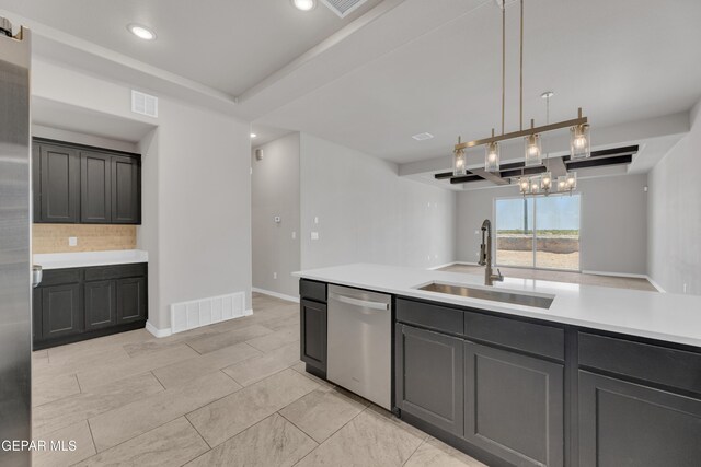 14772 John Mcneely Ave, El Paso, TX 79938 - kitchen with dishwasher, backsplash, light countertops, recessed lighting, and a chandelier