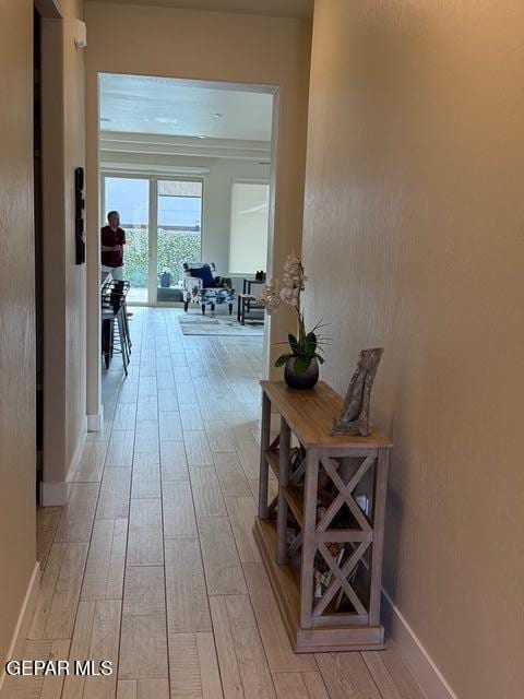 2313 Dancing Piper Way, El Paso, TX 79911 - corridor featuring light wood-style floors and baseboards