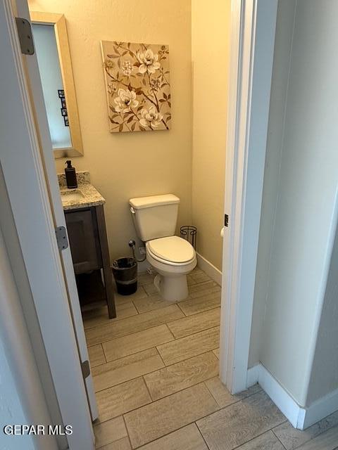 2313 Dancing Piper Way, El Paso, TX 79911 - bathroom featuring wood finish floors and vanity