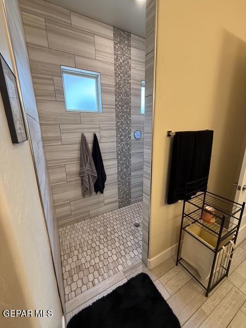 2313 Dancing Piper Way, El Paso, TX 79911 - bathroom with walk in shower and baseboards