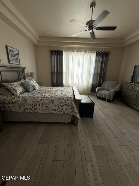 2313 Dancing Piper Way, El Paso, TX 79911 - bedroom with wood finished floors and ceiling fan