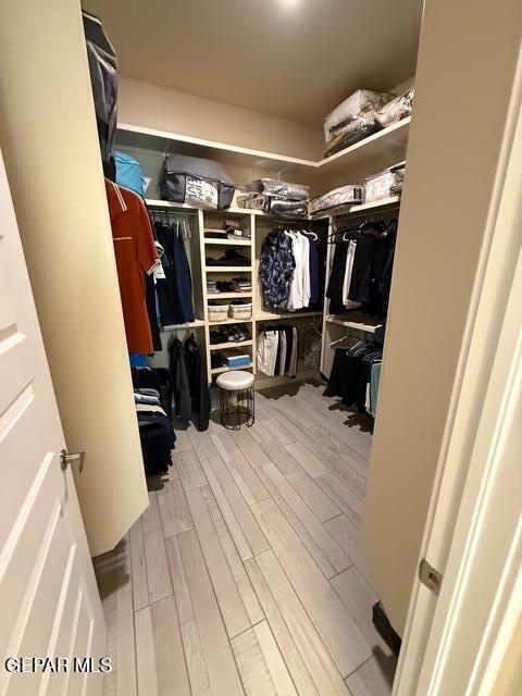 2313 Dancing Piper Way, El Paso, TX 79911 - spacious closet featuring wood finished floors