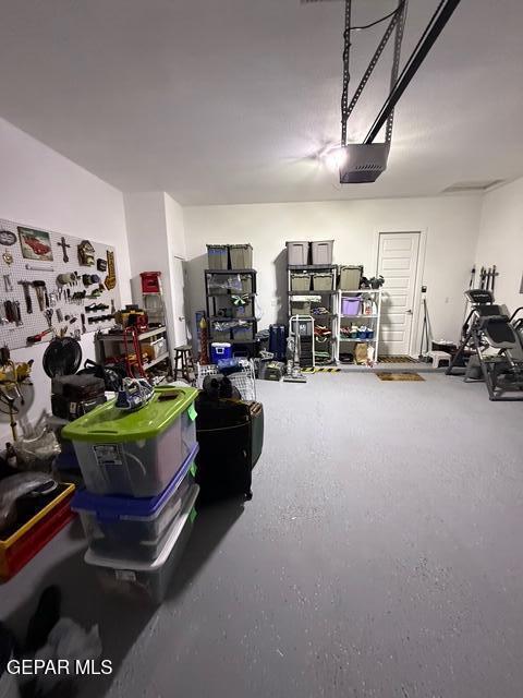 2313 Dancing Piper Way, El Paso, TX 79911 - garage featuring a garage door opener