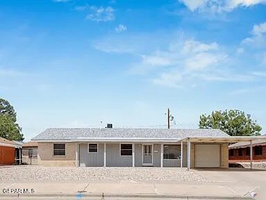 3305 Killarney St, El Paso, TX 79925 - ranch-style home with a garage and driveway