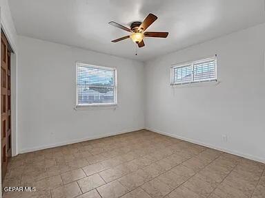 3305 Killarney St, El Paso, TX 79925 - empty room with plenty of natural light and a ceiling fan