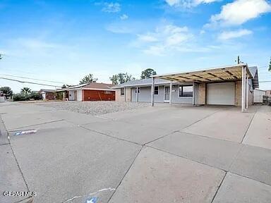 3305 Killarney St, El Paso, TX 79925 - ranch-style home featuring an attached garage and driveway